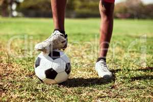 You have to be quick on your feet in this game. Closeup shot of a young boy playing soccer on a sports field.
