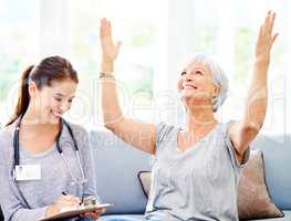 Your test came back negative. A doctor explaining positive test results to an overjoyed senior patient.