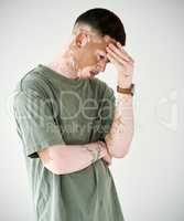 Feeling overwhelmed with stress, anxiety and fear. Studio shot of a young man with vitiligo looking upset against a white background.