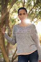 Taking in nature. A young woman enjoying a walk in the woods.