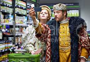 Not too royal to shop. A king and queen taking a selfie in their local supermarket.