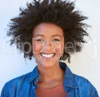 Shes happy-go-lucky. Portrait of an attractive young woman giving you a toothy smile.