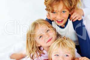Cute little brothers and sisters playing together. Portrait of cute little brothers and sisters playing together.