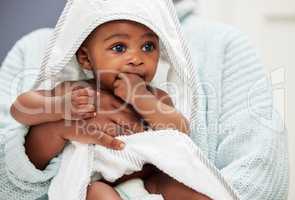 A nap is exactly what I need after that bath. Shot of an adorable baby boy wrapped in a bath towel.