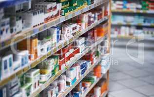 Broad spectrum of brands to get your better. Shot of shelves stocked with various medicinal products in a pharmacy.