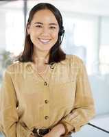 Great customer service leads to increased sales. Portrait of a young businesswoman working in a call centre.