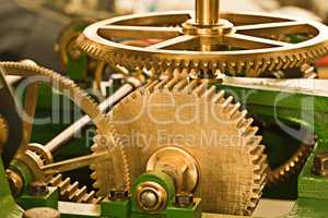 Working like a well-oiled machine. Clockwork machinery that looks well-maintained.