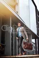 In a big city you need big success. Shot of a handsome and stylish young businessman in an urban setting.