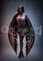 Mysterious beauty. Conceptual shot of a beautiful woman with black wings.