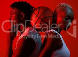 Its the support that gets us through it. Red filtered shot of a sporty young man and woman posing with a basketball in between them.