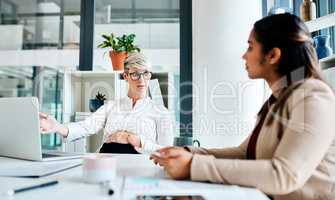 Id like you to handle these duties once I leave. Shot of a pregnant businesswoman having a discussion with her colleague in an office.