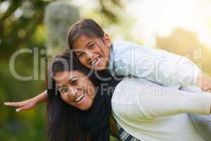 Its always bliss when were together. Portrait of a mother and daughter enjoying the day outdoors together.
