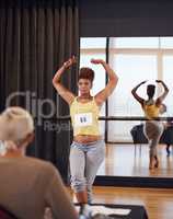 Shes rocking this audition. Shot of a young female dancer doing an audition before a judge.