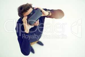 Discover more than you would ever imagine. High angle shot of a businessman wearing a VR headset in an office.