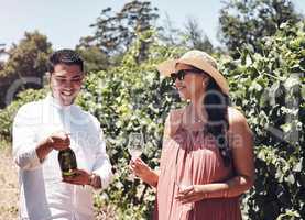 This date is extra special. Shot of a young couple out on a date at a vineyard.