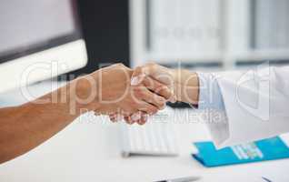 Its always a pleasure. Cropped shot of an unrecognizable doctor shaking hands with her patient during a consult in the clinic.