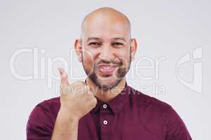 Agreement is guaranteed. Studio portrait of a handsome young man giving a thumbs up against a grey background.