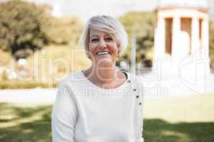 It turned out to be such a beautiful day. Portrait of a mature woman outdoors.