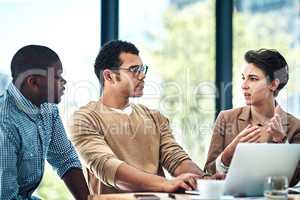 Develop and sell products and services you love. Cropped shot of three designers having a brainstorming session at the office.