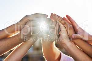 Positive partnerships. Shot of a group of hands holding on to each other.