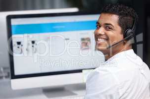You can reach us through multiple channels online too. Portrait of a young businessman working on a computer in a call centre.