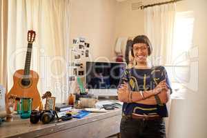 She brings her creativity to life here. Portrait of a stylish young designer standing in her eclectic studio.