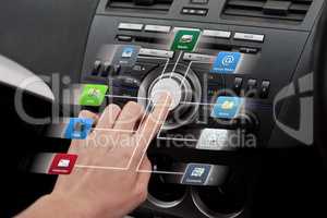 Access to your applications wherever you go. Closeup shot of a driver accessing digital applications inside a motor vehicle.