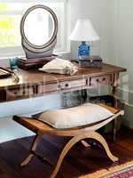 Antique dressing table. Beautiful wooden dressing table and mirror in a hotel bedroom.