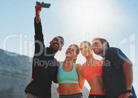 Take this for some fitness inspiration. Shot of a group of friends taking a selfie while out for a workout.