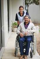 I can always count on the quality care here. Portrait of a senior man in a wheelchair being for for by a nurse at a retirement home.