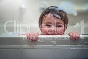 What is bath time without the bubbles. Portrait of a little boy sitting in a bathtub.