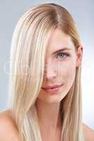 Blonde and beautiful. Studio portrait of a young woman with long blonde hair.