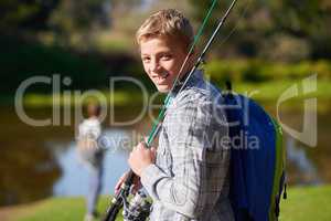 Gone fishing. Shot of a young boy on a fishing trip.