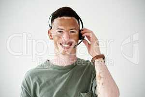 Id be happy to speak to you about our offers. Studio portrait of a young man with vitiligo wearing a headset against a white background.
