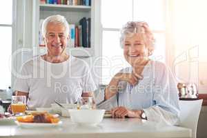 Its not just about sharing breakfast - its about sharing love. Portrait of a senior couple having breakfast together at home.