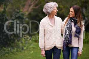 Im so glad you came to visit. Shot of an attractive woman spending time with her senior mother outdoors.