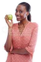 Shes into eating healthily. Portrait of an attractive young woman holding an apple.