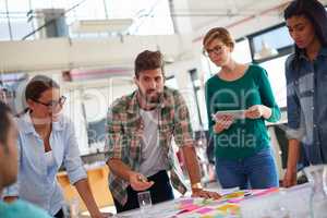 An informal business meeting. A group of informal businesspeople in a meeting.