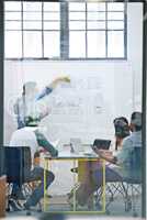 This here makes for the best possible flow. Cropped shot of a group of architects discussing plans.