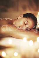 Allow yourself to be where you are. Cropped shot of a young woman getting an exfoliating treatment at the spa.