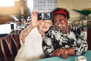 Special memories with a special friend, selfie style. Shot of a happy senior woman taking a selfie with her friend at home.