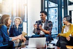 They share a collective vision aimed at success. Cropped shot of a group of colleagues having a meeting in a modern office.