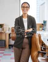 Success stems from your attitude and outlook. Portrait of a confident young businesswoman standing with her arms crossed in an office.