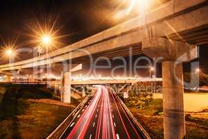 Lights in a busy city. Shot of a traffic on the motorway.