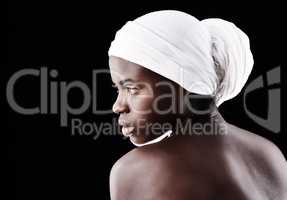 Her beauty speaks for itself. Studio shot of a beautiful woman wearing a headscarf against a black background.