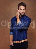 Rugged good looks and style. Studio shot of a stylishly dressed young man.