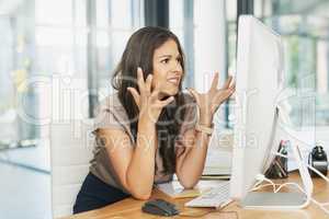 Why is this happening now. Shot of a frustrated businesswoman looking at her computer in dismay.