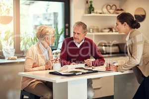 Putting something aside for retirement is an unavoidable necessity. Shot of a senior couple getting advice from their financial consultant.