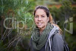 Immersed in nature. Portrait of an attractive young female hiker in the outdoors.