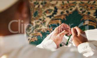 Finding my faith, right now where Im at. Shot of a unrecognizable muslim male praying in a mosque.